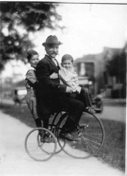 Young Robert and Paul Gach, with Joe Lichtenstein, on a tricycle!