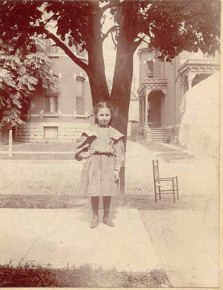 Young Hilda, outsite, in the neighborhood.